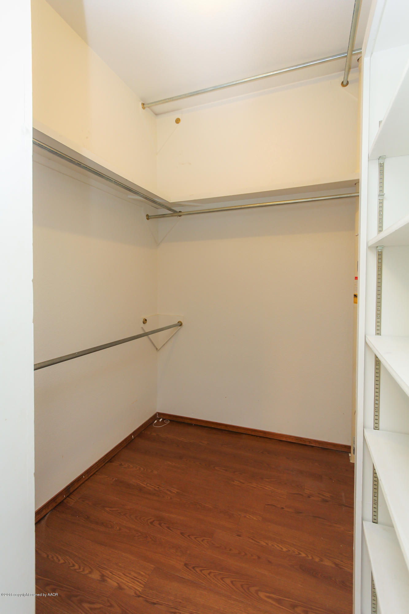 7915 Santa Fe Trail Amarillo, TX 79110 - Photo 27 of 57 a view of an empty walk in closet with empty racks