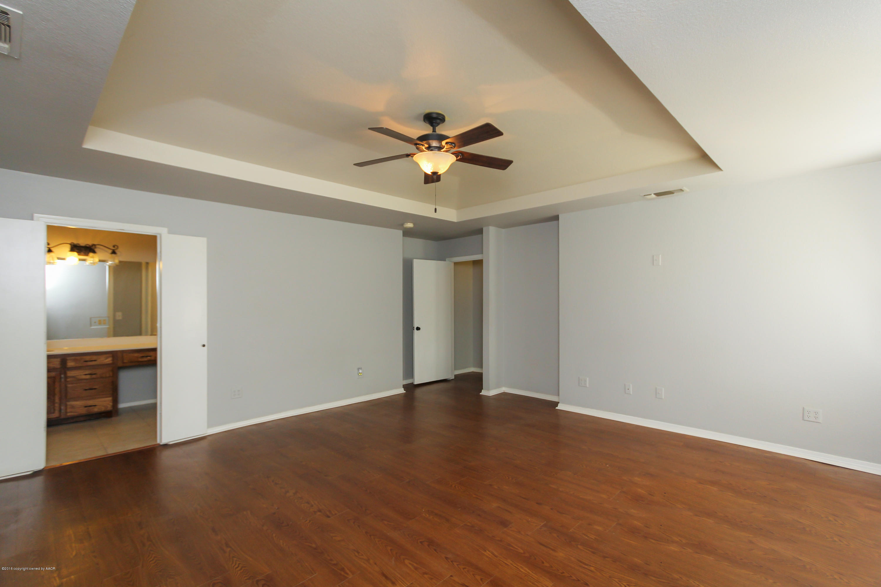 7915 Santa Fe Trail Amarillo, TX 79110 - Photo 28 of 57 wooden floor in an empty room with a window