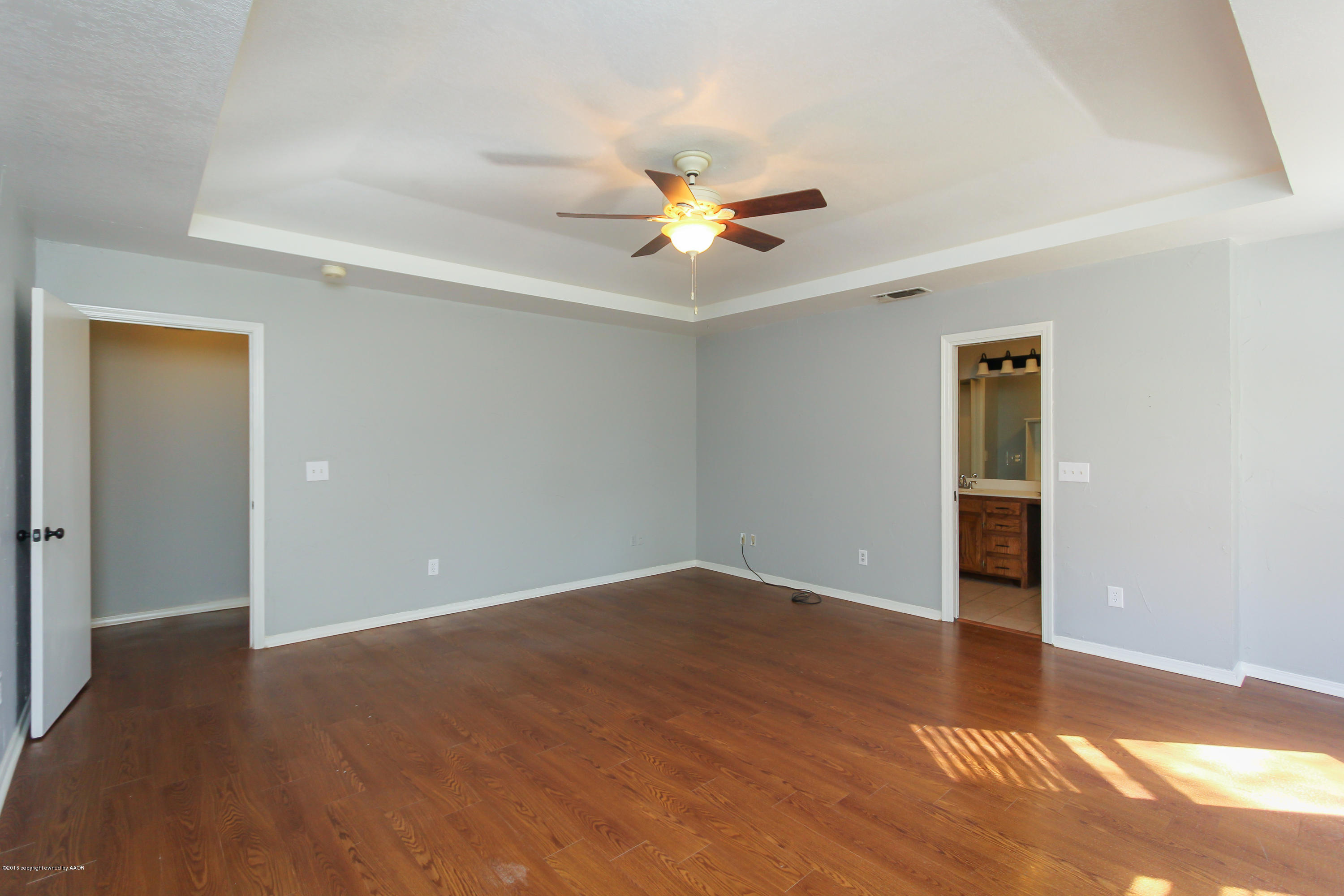 7915 Santa Fe Trail Amarillo, TX 79110 - Photo 33 of 57 wooden floor in an empty room with a window