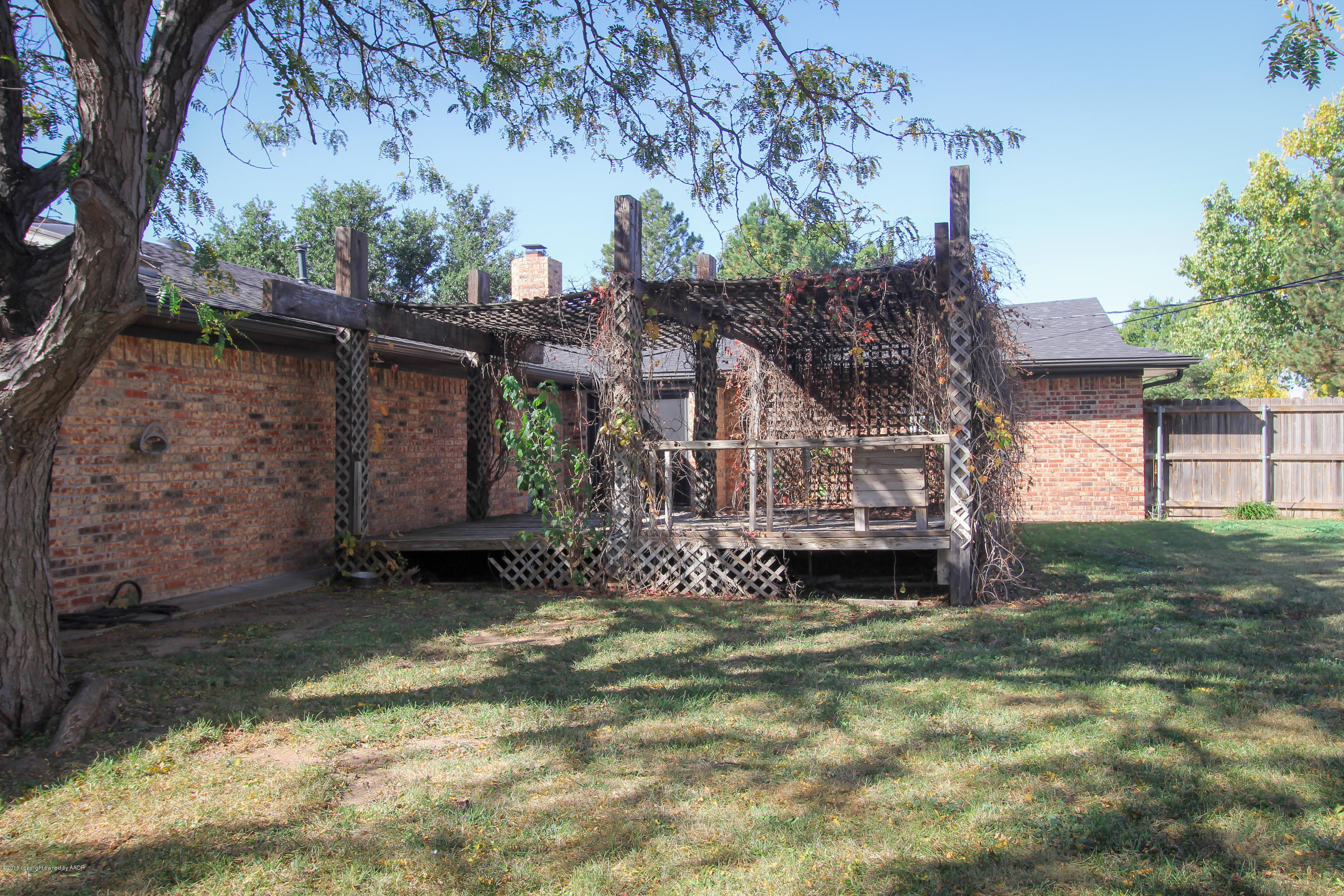 7915 Santa Fe Trail Amarillo, TX 79110 - Photo 50 of 57 a view of a house with a yard