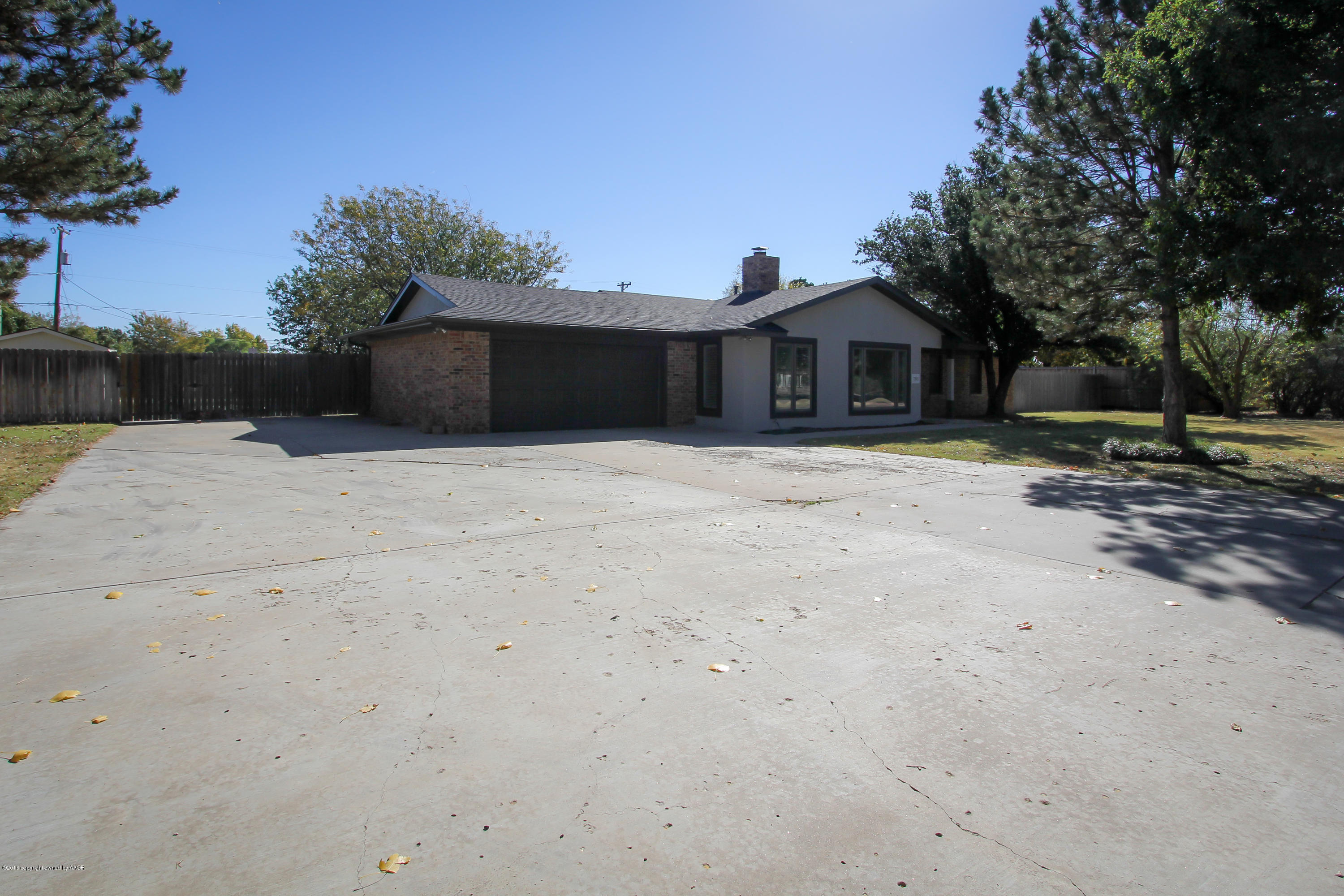 7915 Santa Fe Trail Amarillo, TX 79110 - Photo 56 of 57 a front view of a house with a yard