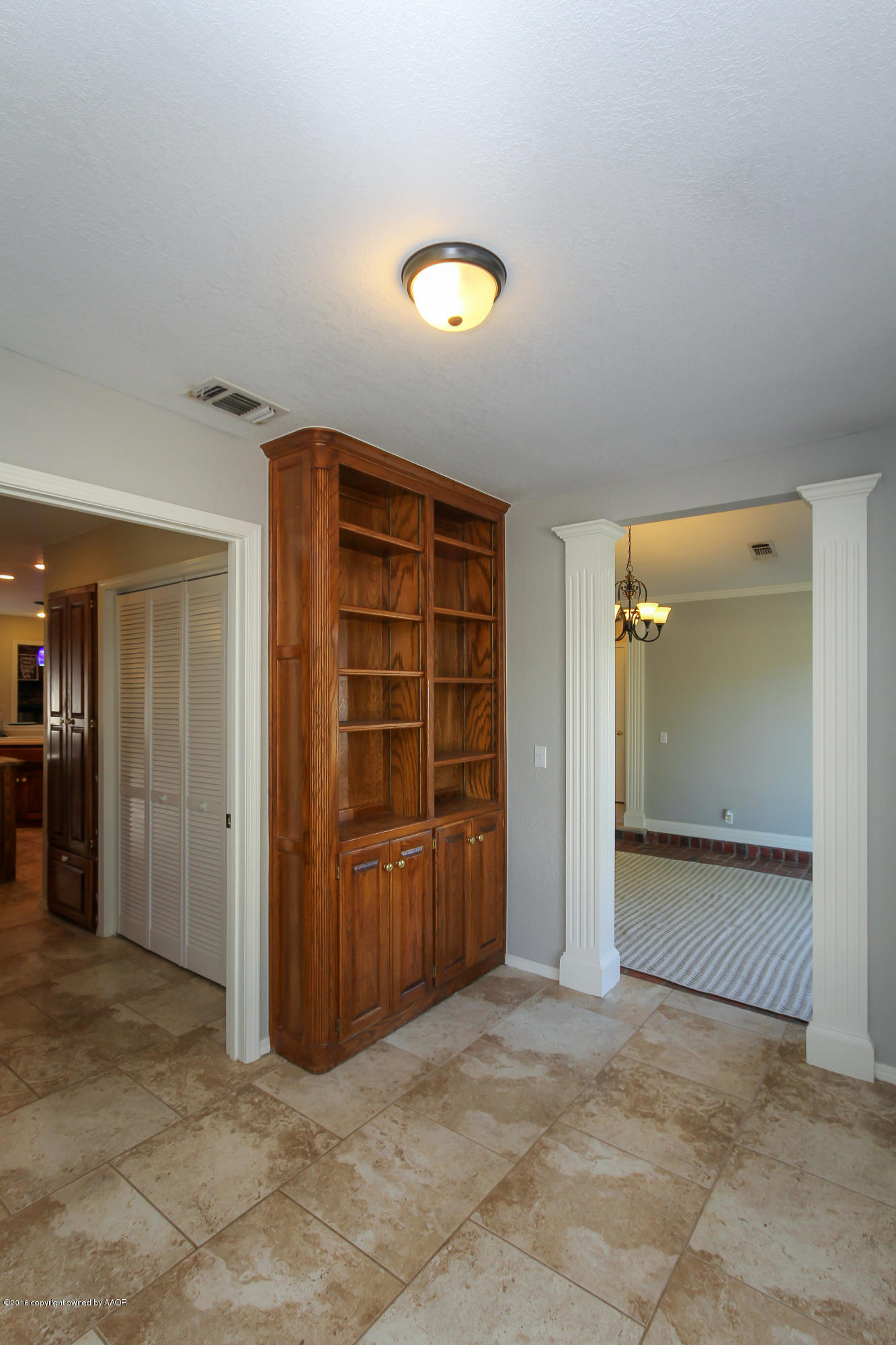 7915 Santa Fe Trail Amarillo, TX 79110 - Photo 8 of 57 an empty room with closet and wooden door