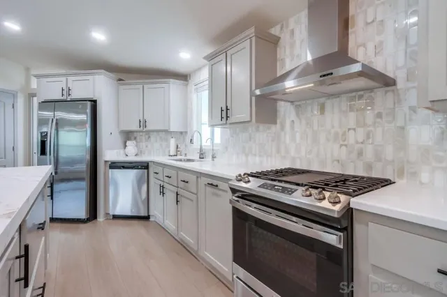 a spacious bathroom with a double vanity sink mirror double shower and a bathtub