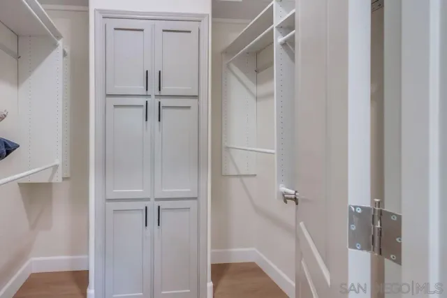 a patio with a table and chairs under an umbrella