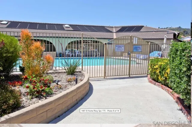 a kitchen with kitchen island a table and chairs in it