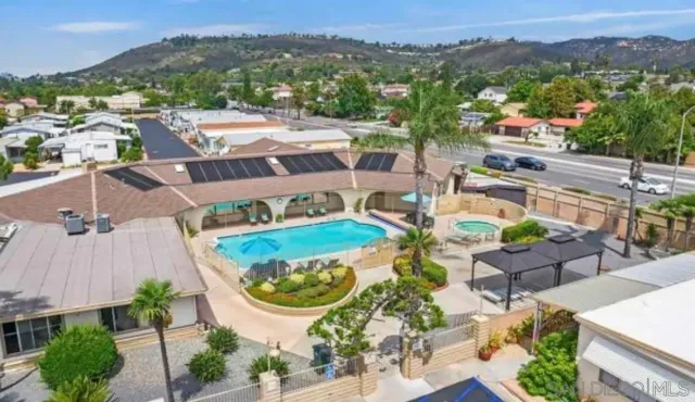 a open dining room with cabinets and wooden floor