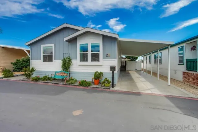 a bedroom with a bed a table and chairs