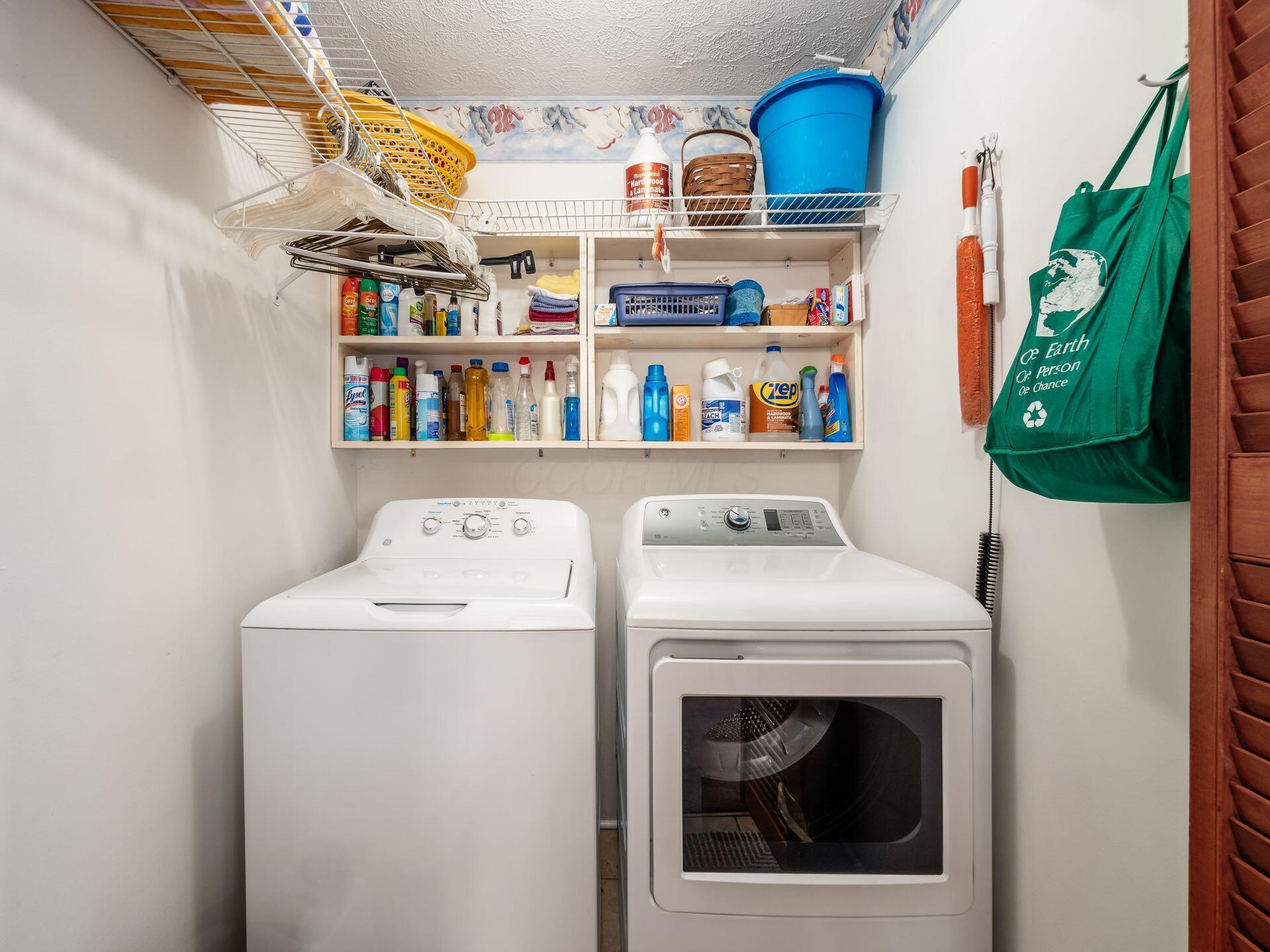 12741 Goodman Road Ashville, OH 43103 - Photo 27 of 61 The utility room offers plenty of storage plus hanging racks