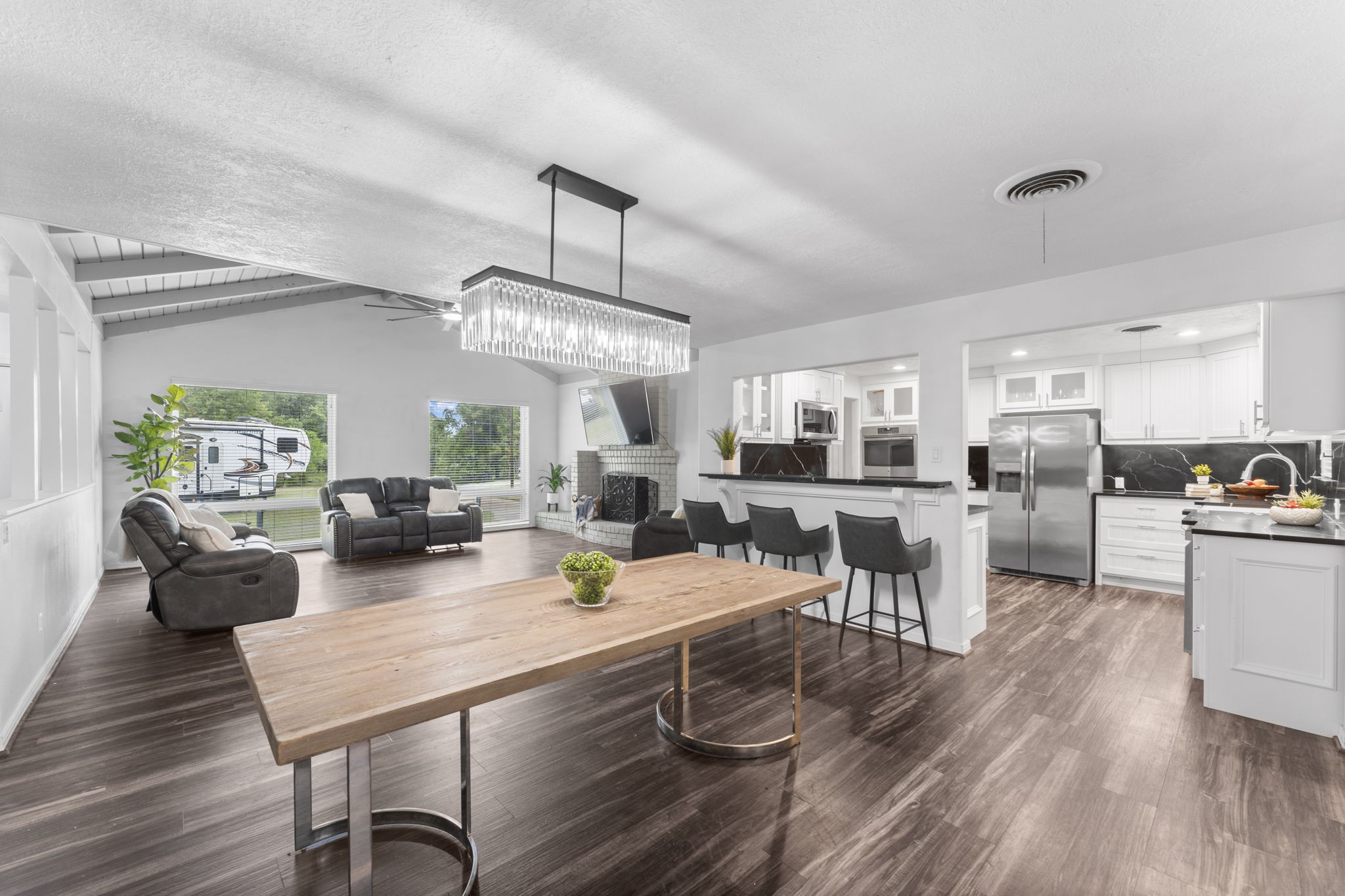 910 Imperial Lane Houston, TX 77336 - Photo 1 of 26 a view of a dining room with furniture a rug and wooden floor