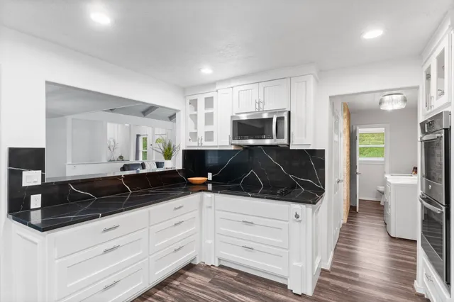 a kitchen with a sink stove and refrigerator