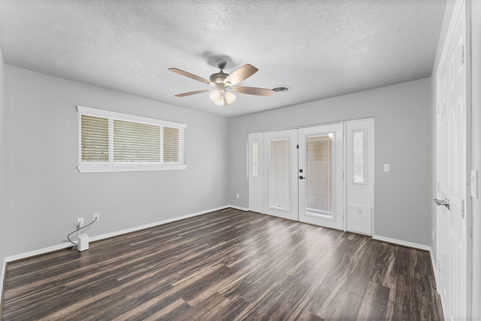 910 Imperial Lane Houston, TX 77336 - Photo 18 of 26 wooden floor in an empty room with a window