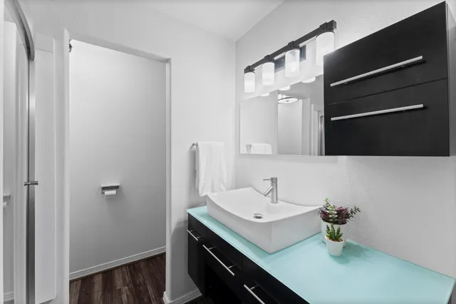 a bathroom with a sink and a mirror