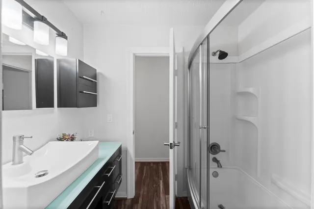 a bathroom with a sink and a mirror