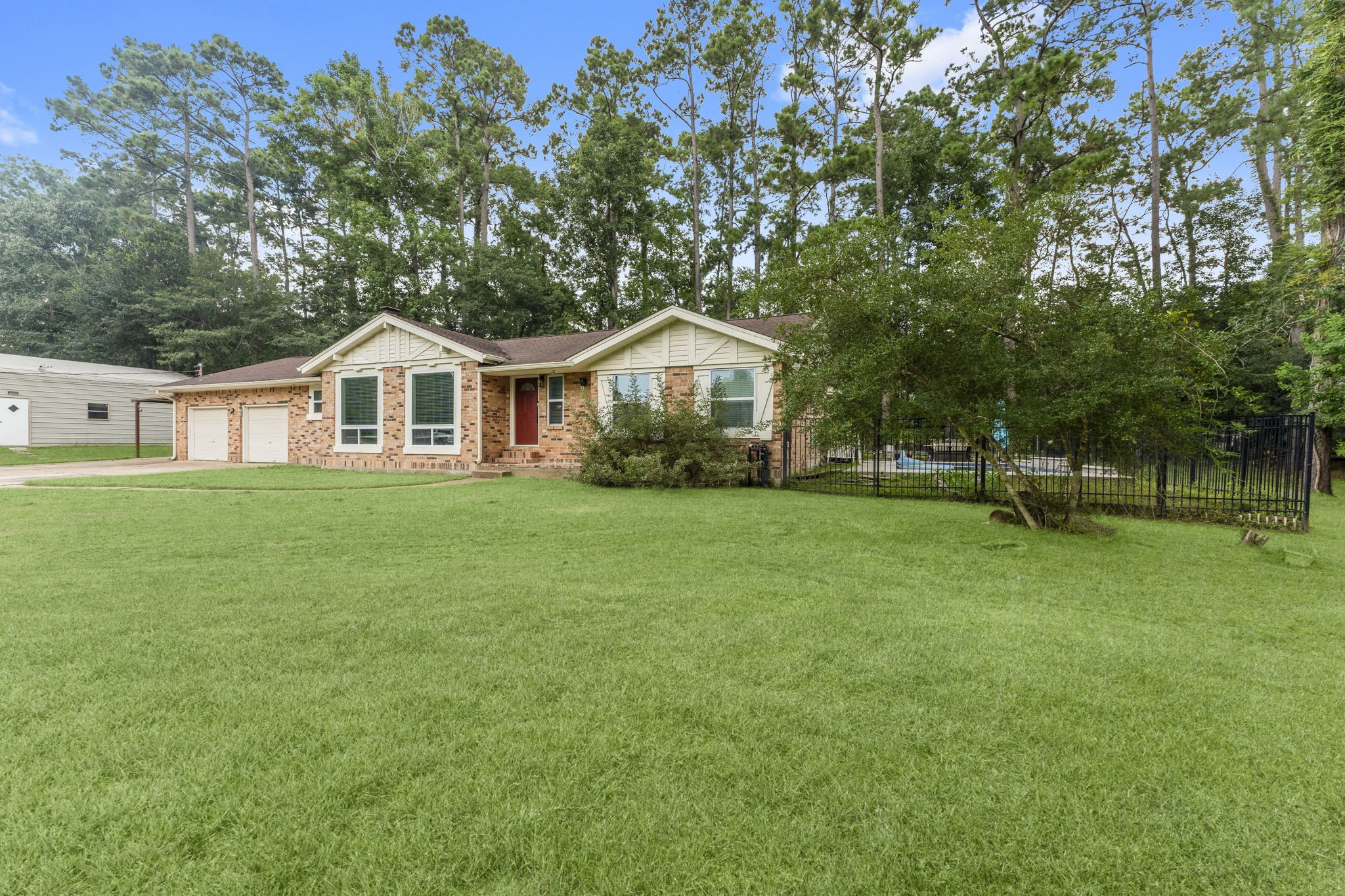 910 Imperial Lane Houston, TX 77336 - Photo 21 of 26 a front view of a house with a yard