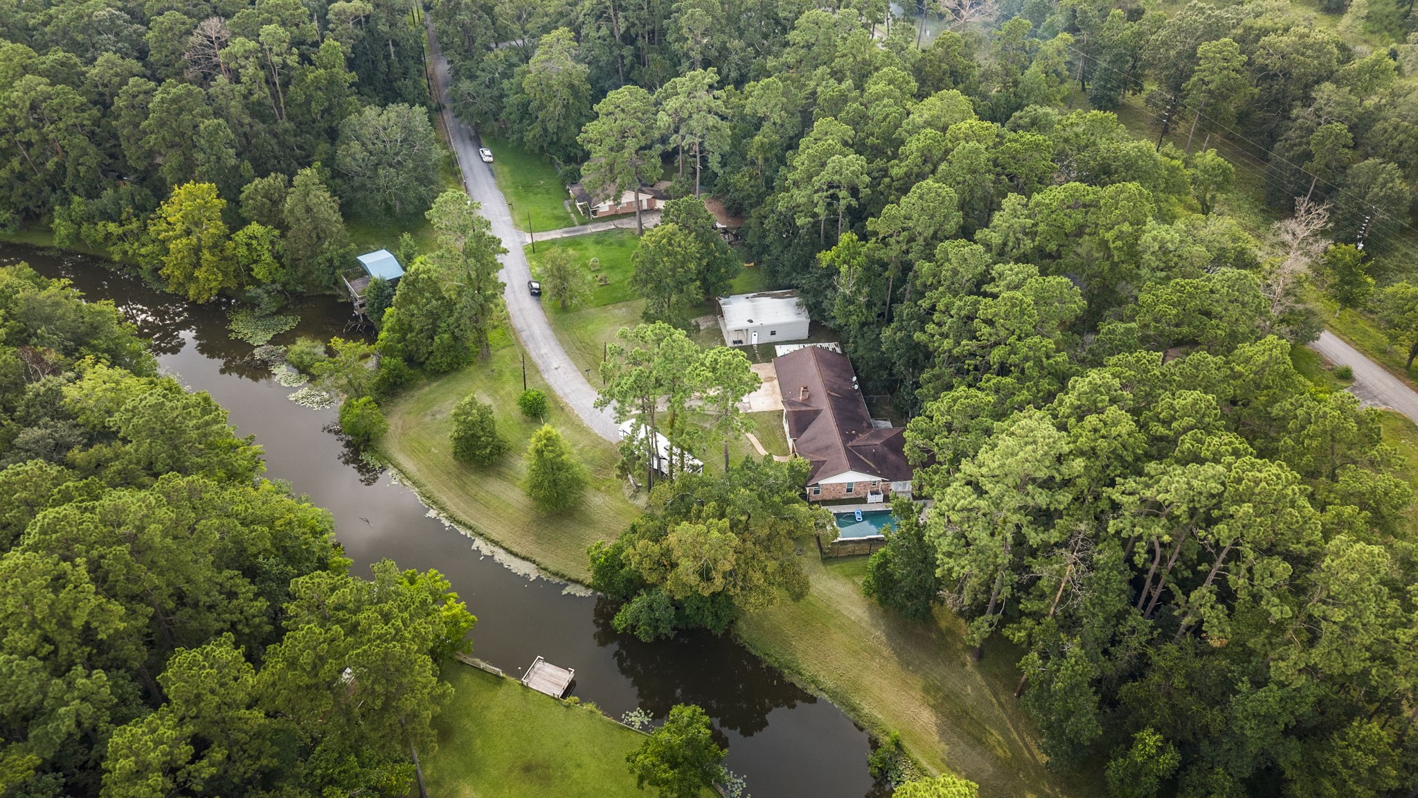 910 Imperial Lane Houston, TX 77336 - Photo 24 of 26 an aerial view of residential house with outdoor space and trees all around
