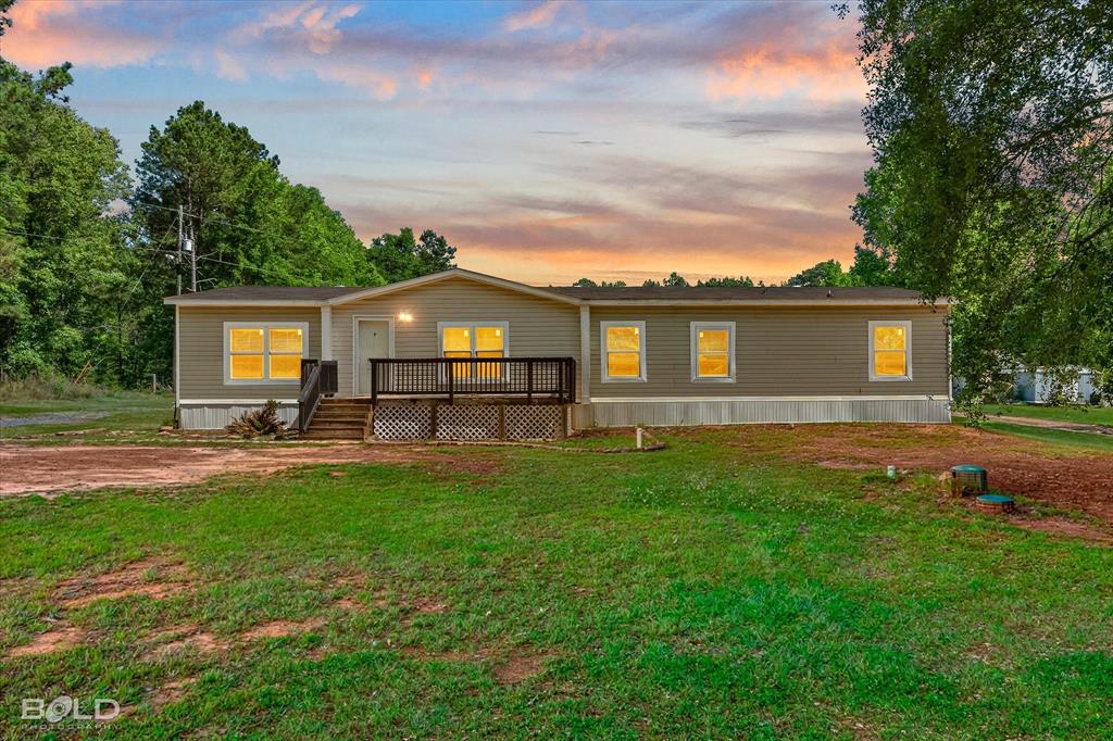 2153 Highway 2 Plain Dealing, LA 71064 - Photo 2 of 39 a view of a house with a backyard