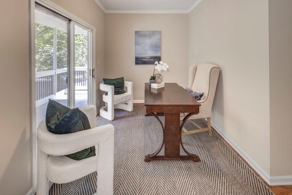 2059 Howell Mill Road Northwest Atlanta, GA 30318 - Photo 13 of 28 a living room with furniture a rug potted plant and a large window