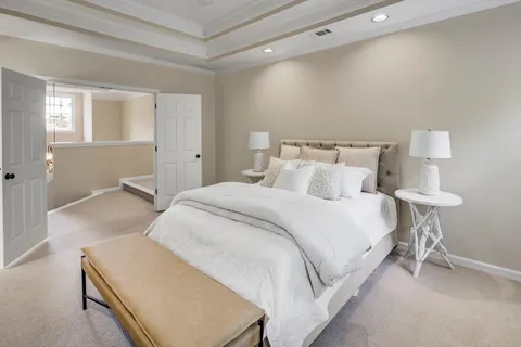 a bedroom with a bed and a lamp