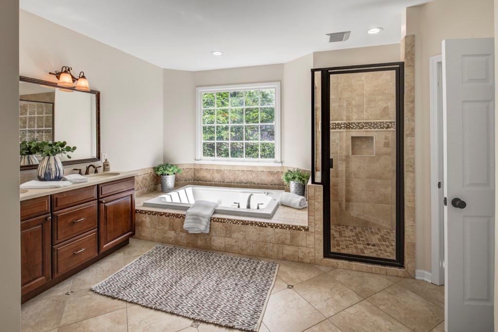 2059 Howell Mill Road Northwest Atlanta, GA 30318 - Photo 17 of 28 a spacious bathroom with a bathtub sink and toilet
