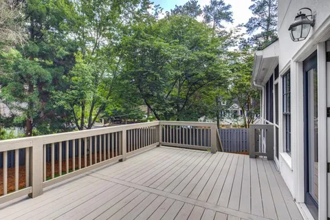 a view of deck with wooden floor and fence