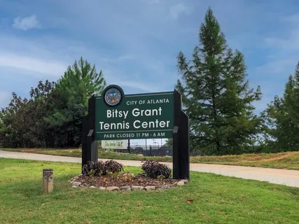 a view of a park with welcome board