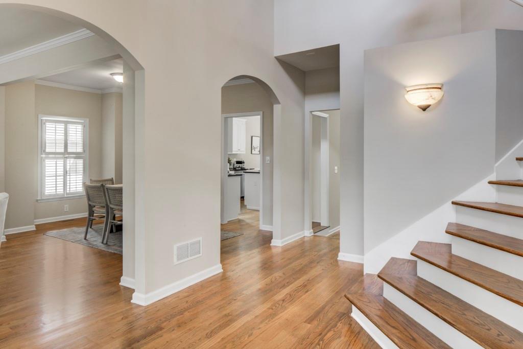 2059 Howell Mill Road Northwest Atlanta, GA 30318 - Photo 3 of 28 wooden floor in an empty room with a fireplace
