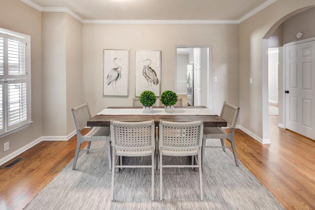 2059 Howell Mill Road Northwest Atlanta, GA 30318 - Photo 6 of 28 a dining room with furniture and wooden floor