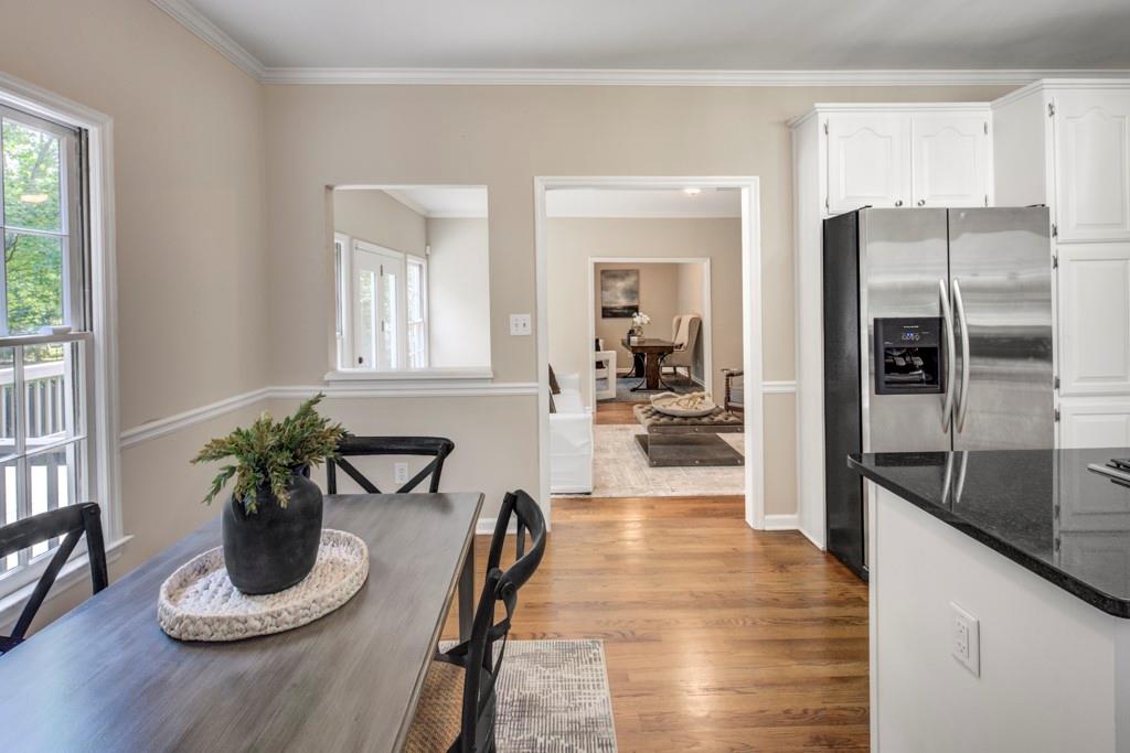 2059 Howell Mill Road Northwest Atlanta, GA 30318 - Photo 9 of 28 a hallway with wooden floor and a potted plant