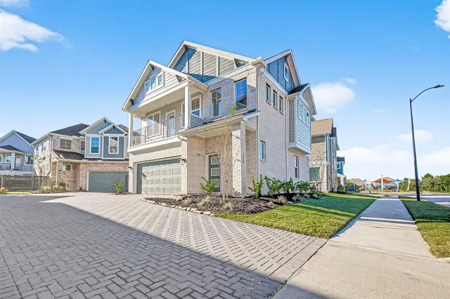 a view of multiple houses with a street