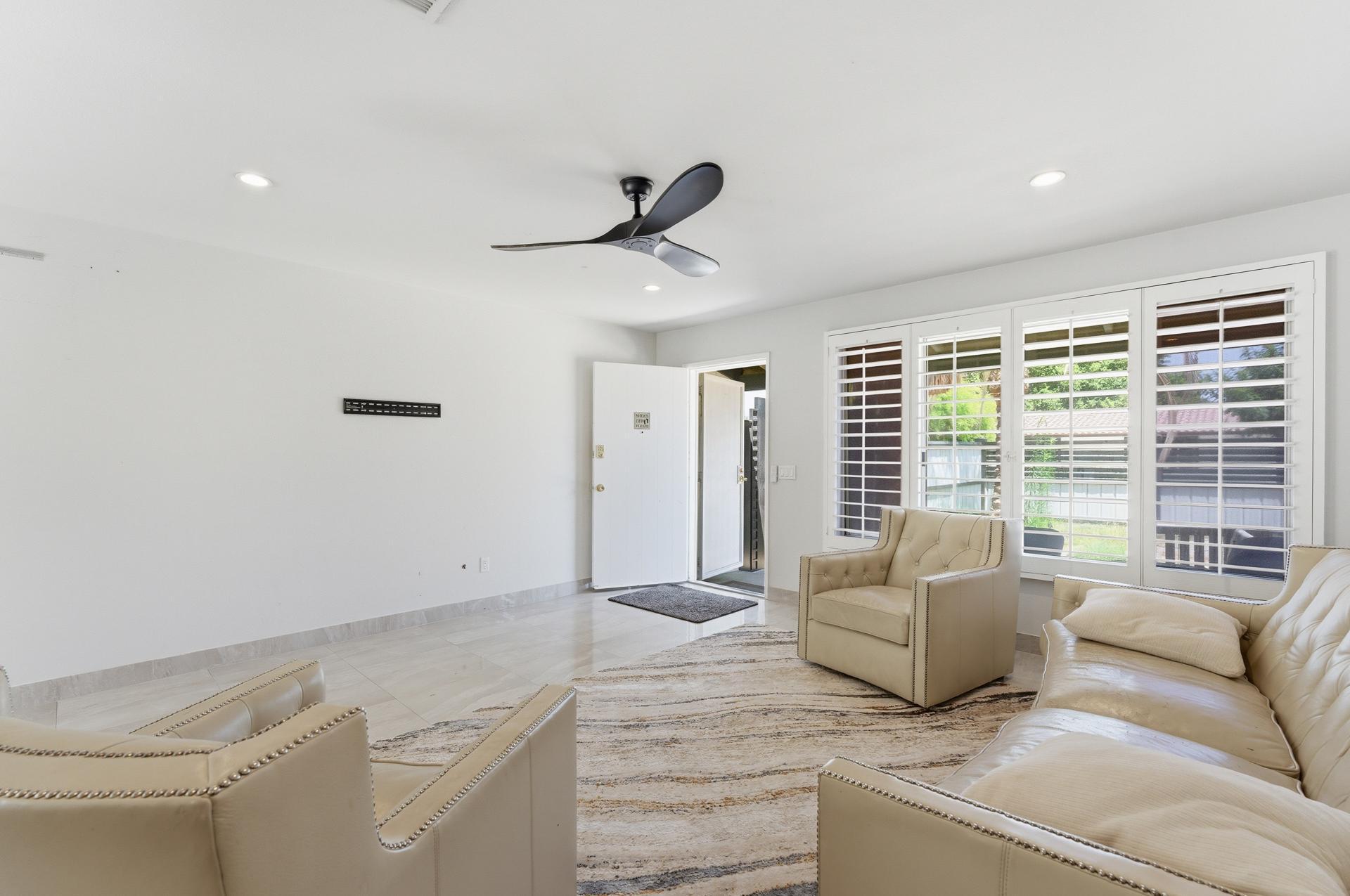 40961 Cecina Way Bermuda Dunes, CA 92203 - Photo 21 of 27 a living room with furniture and a large window