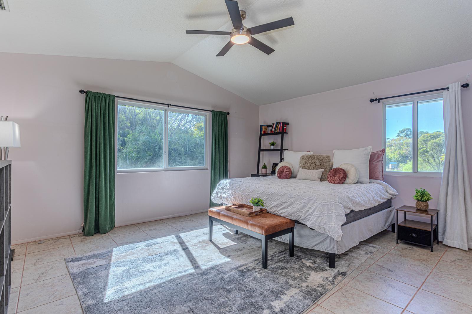 4852 Windmill Road Loxahatchee, FL 33470 - Photo 5 of 12 a bed room with a bed and a window