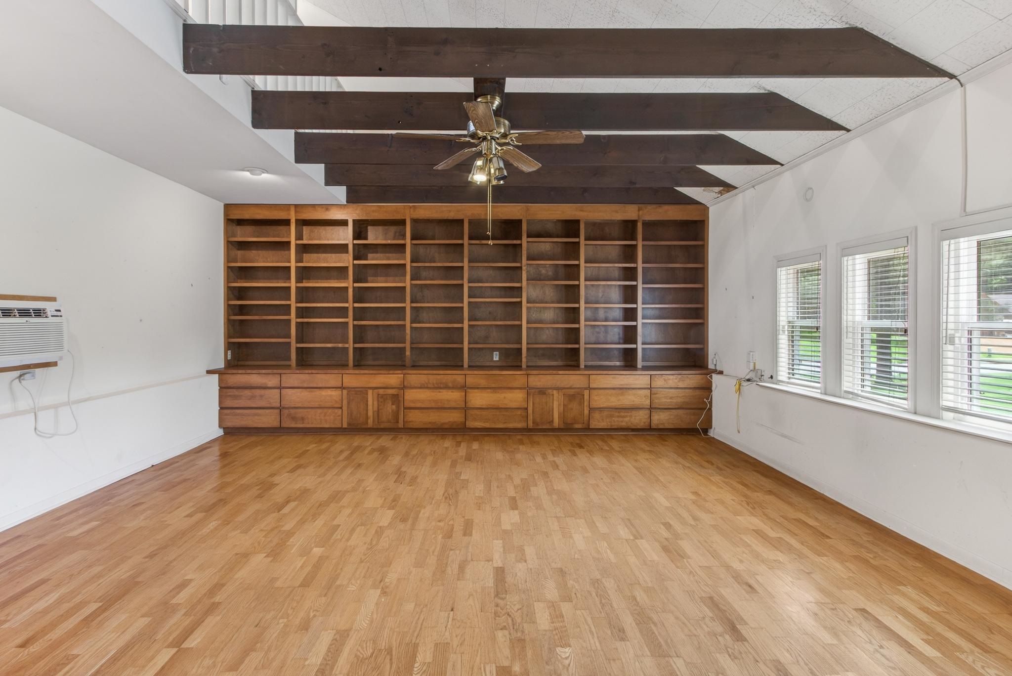 3121 Beechrun Drive Memphis, TN 38128 - Photo 17 of 40 A stunning sunken den, thoughtfully and professionally converted from the original garage, is filled with character and architectural interest with it's beamed ceiling, abundant natural light and gorgeous hardwood floors!