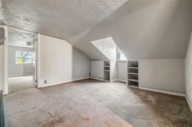 an empty room with a empty space and window