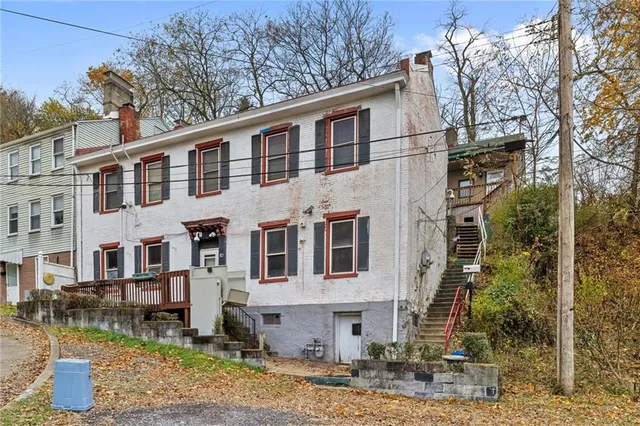 a view of a house with a door and a window