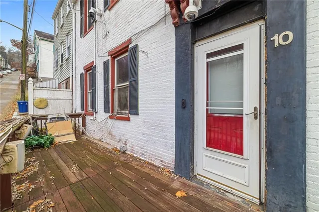 a living room with stainless steel appliances kitchen island granite countertop furniture and a window