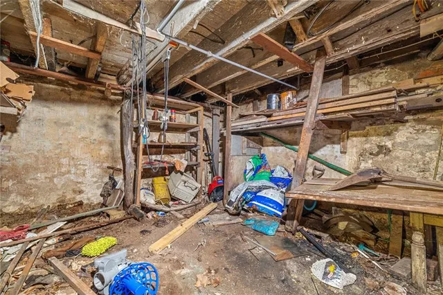 a living room with furniture a rug and a window