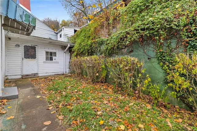 a view of a room with furniture and a window
