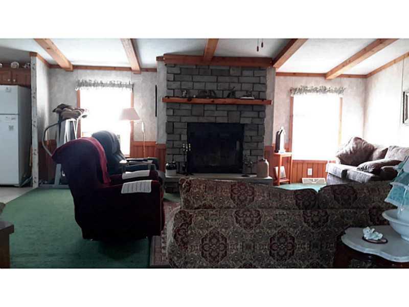 350 Transalpine Road Lincoln, ME 04457 - Photo 14 of 27 Living Room. Large windows, vaulted,...