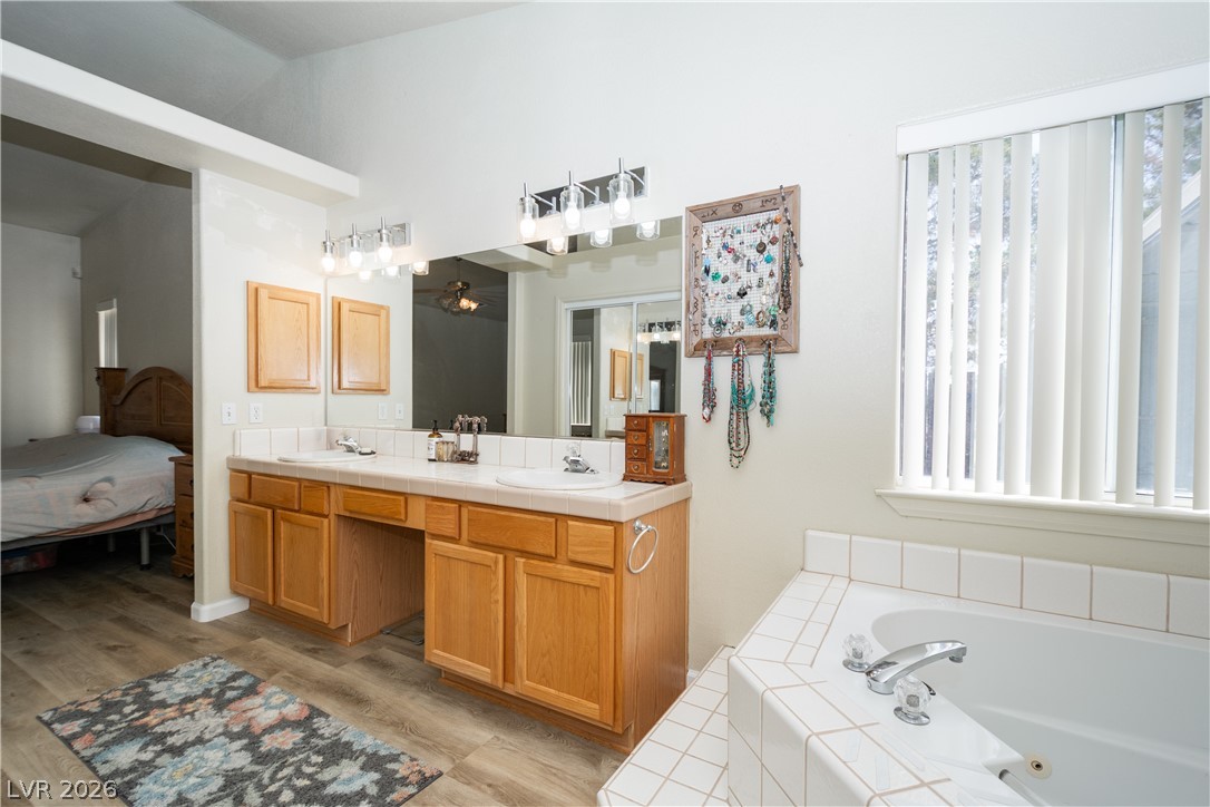 2381 Tough Boy Road Pahrump, NV 89060 - Photo 18 of 44 This spacious bathroom offers a double vanity and a comfortable soaking tub.
