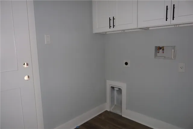 a view of cabinets and wooden floor