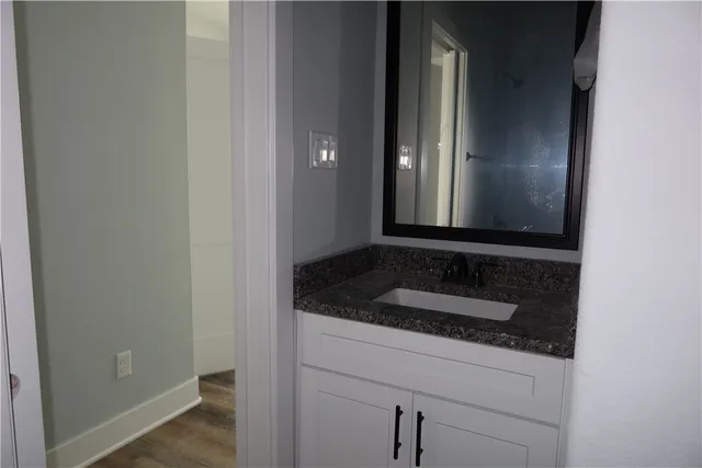 a bathroom with a sink and a mirror