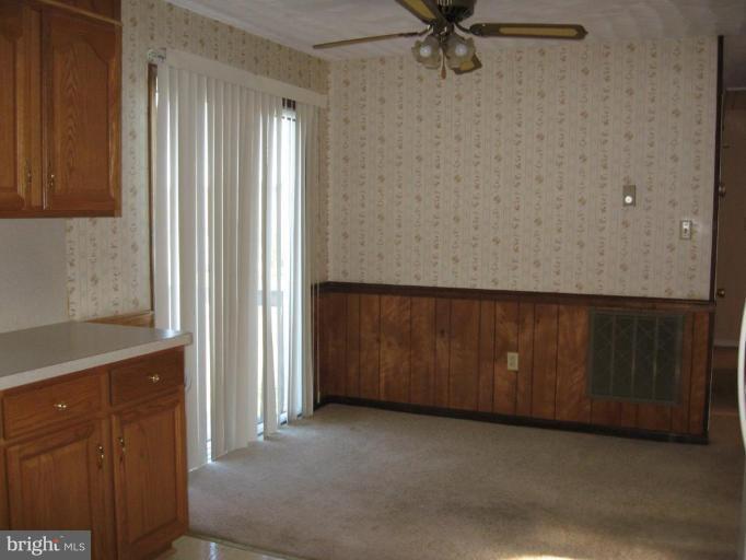 9263 White Shop Road Culpeper, VA 22701 - Photo 7 of 8 Dining area with sliding glass doors to deck