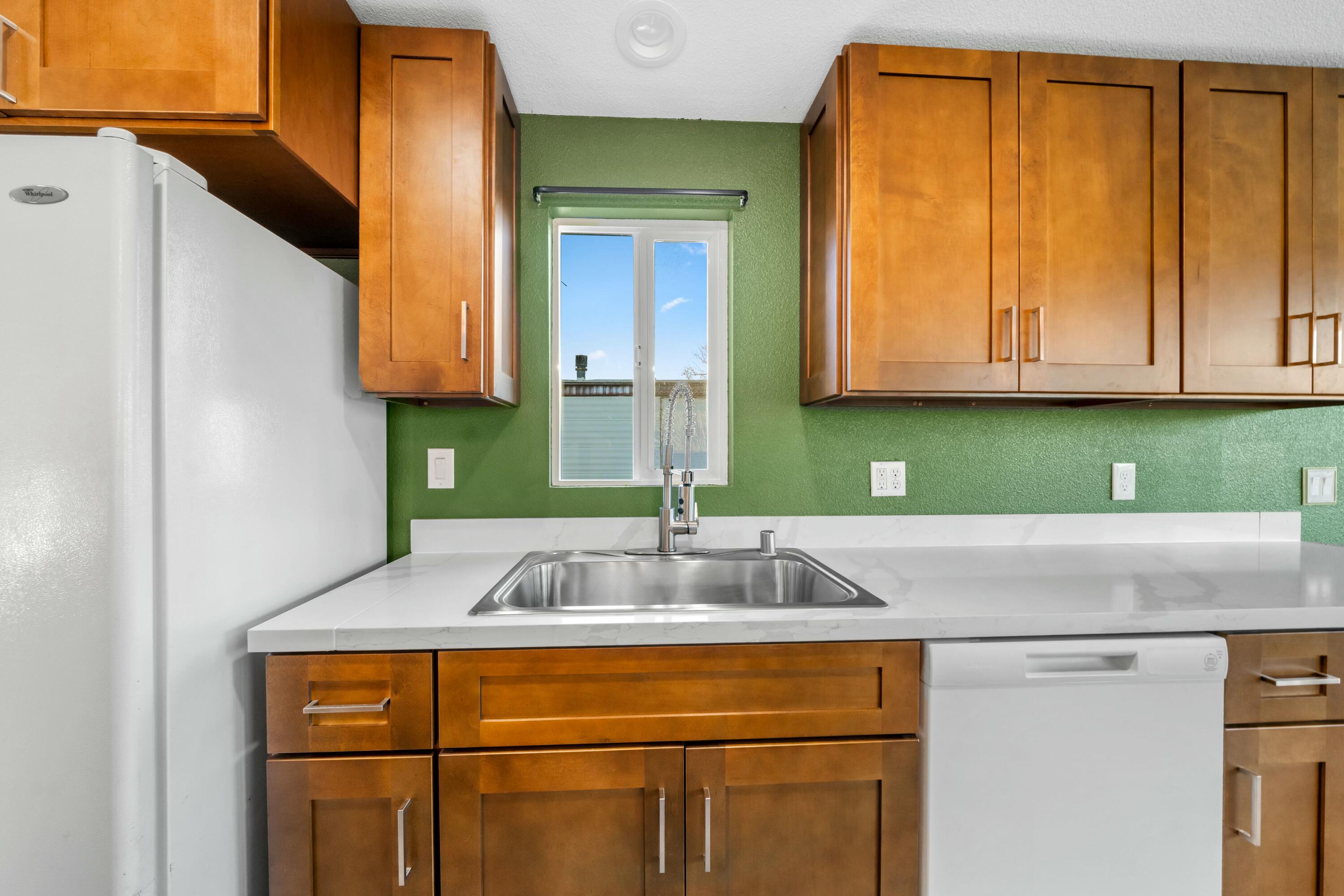 22235 Lone Tree Road, Unit 4 Anderson, CA 96007 - Photo 5 of 15 a kitchen with a sink and a cabinets