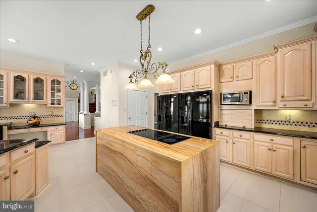 a white bath tub sitting in a bathroom next to a window