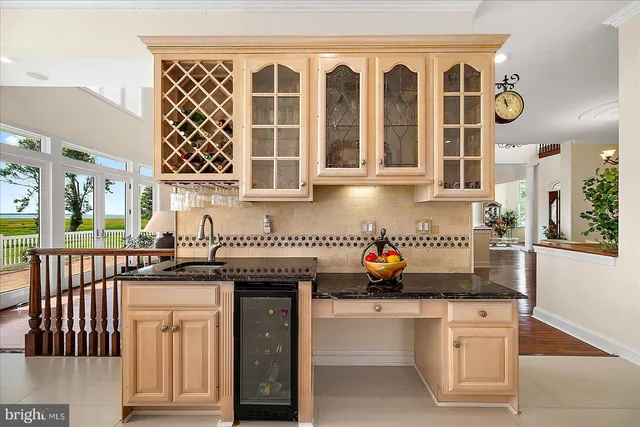 a dining room with wooden floor a table and chairs