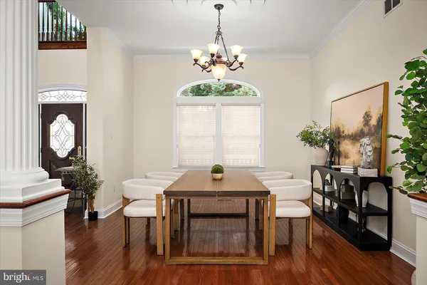 a view of a livingroom with furniture and hardwood floor