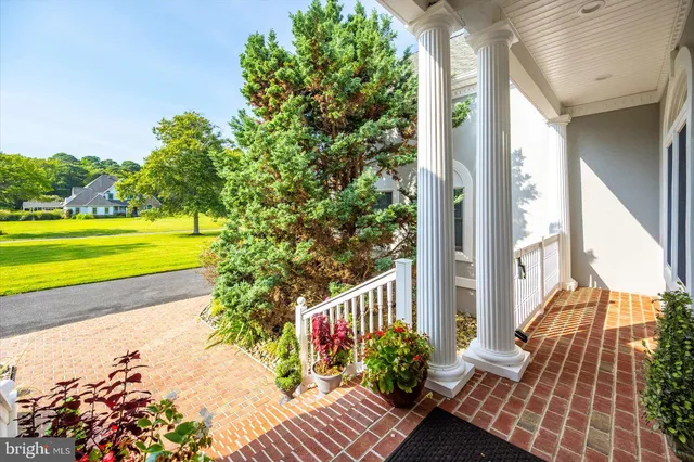 a kitchen that has a lot of cabinets in it and wooden floors