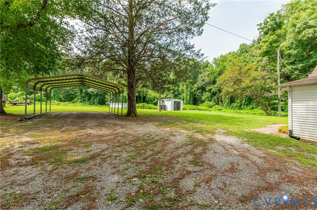 661 CCC Road Crewe, VA 23930 - Photo 34 of 38 Expansive gravel driveway leading to a multi-vehic