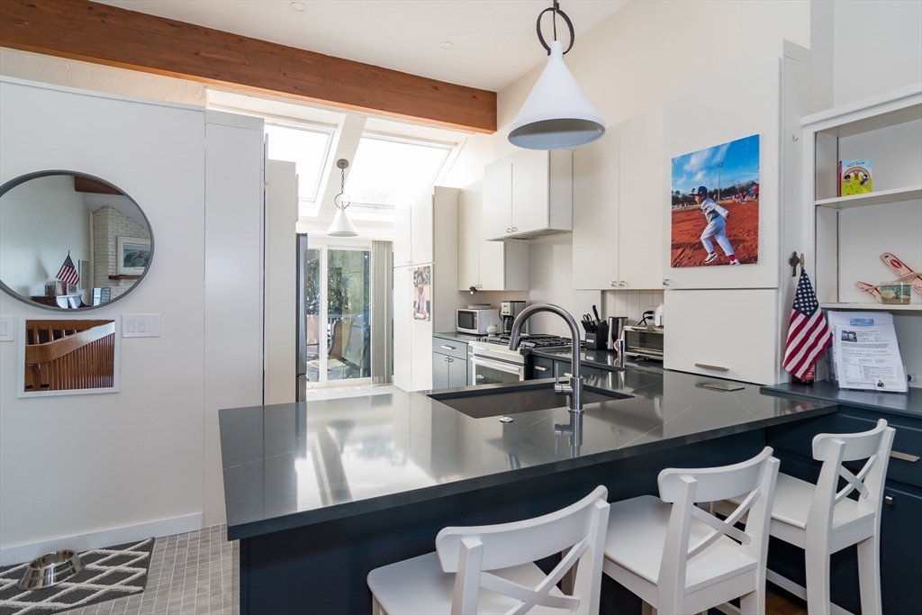 22 Oceanside Drive, Unit 22 Hull, MA 02045 - Photo 16 of 37 a dining room with furniture and window