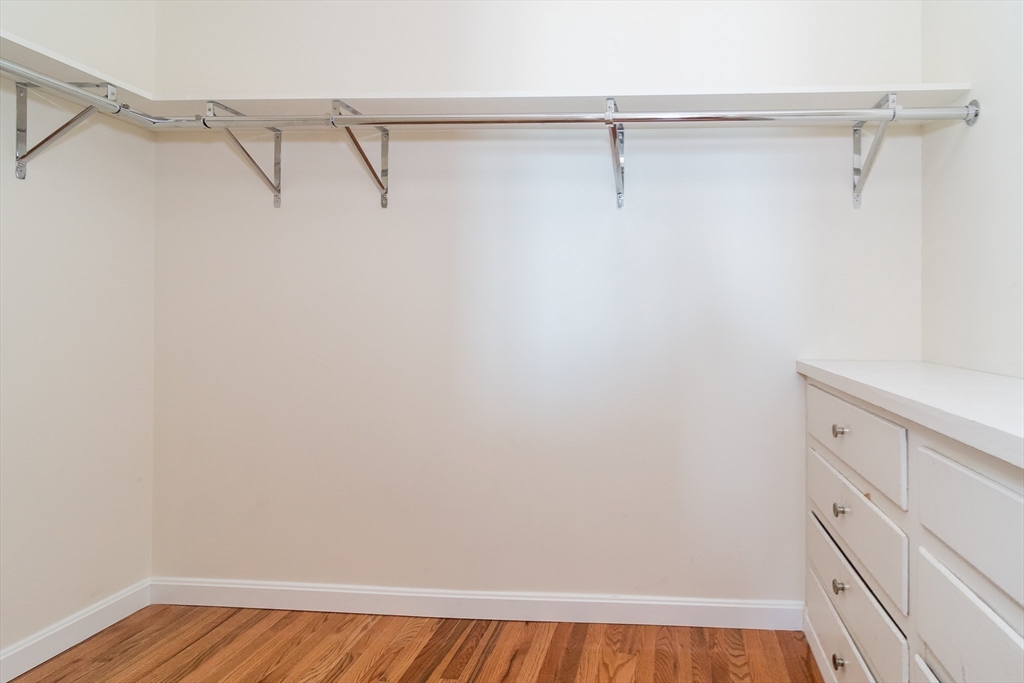 22 Oceanside Drive, Unit 22 Hull, MA 02045 - Photo 23 of 37 a view of a room with racks on the wall